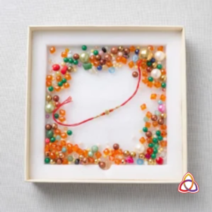 Artisan’s Treasure: Gilded Sphere & Gem Beaded Rakhi Gift Box