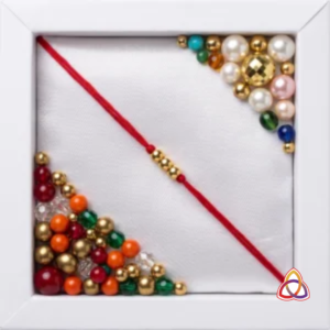 Minimalist Red Mauli Rakhi with Gold Cylinder Accents