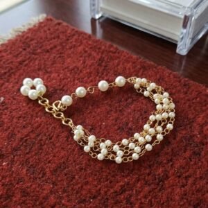 Breslet feature variations of black, white, and grey beads.